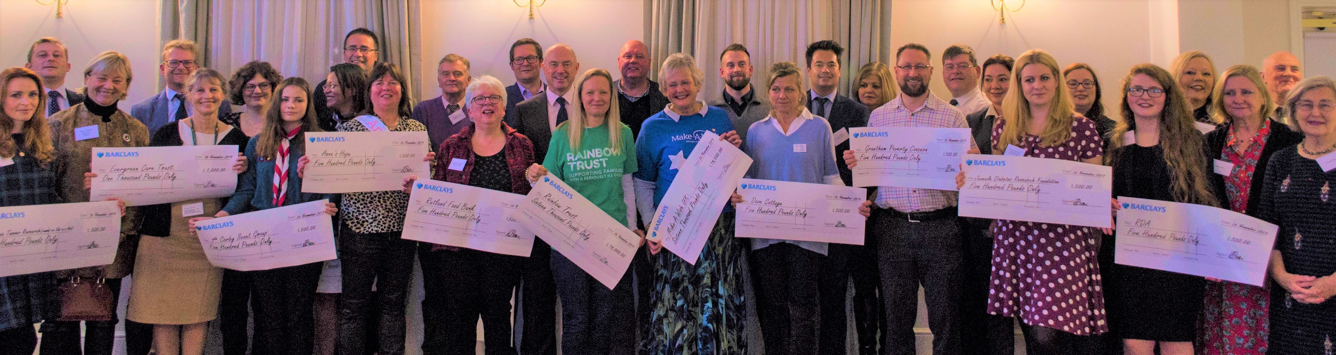 £40K ruby year fundraising cheques are handed over to 17 charities